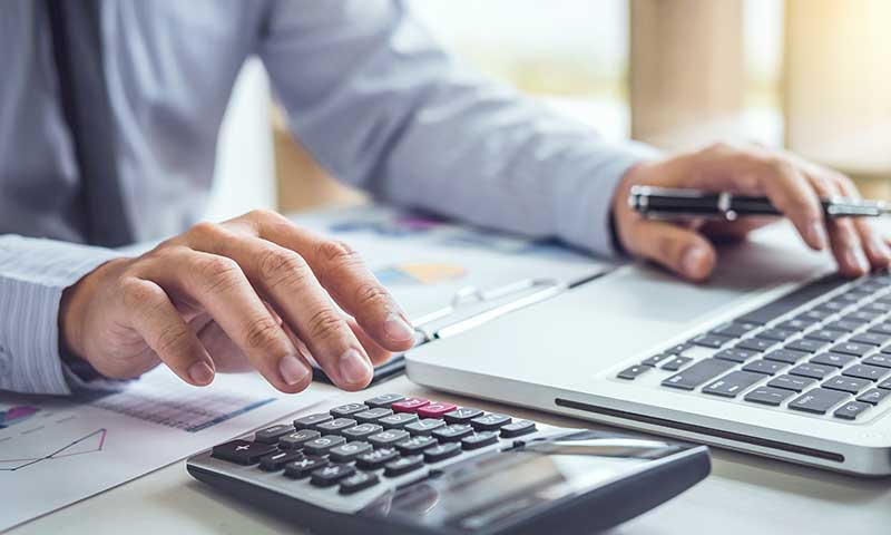 Accounting Services - businessman calculating